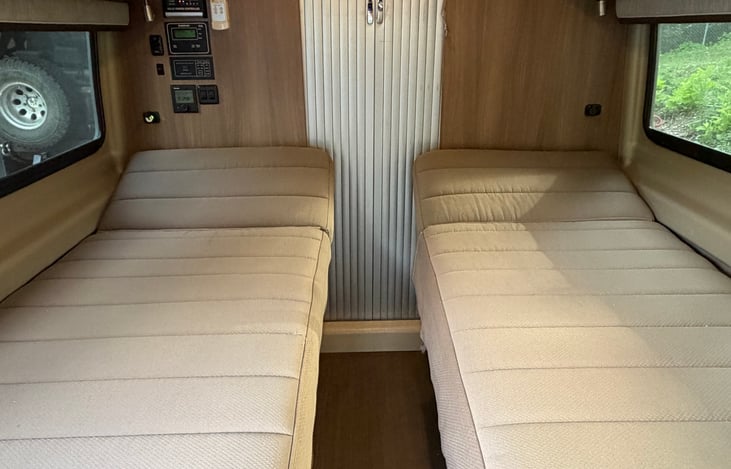 Twin beds with adjustable head.