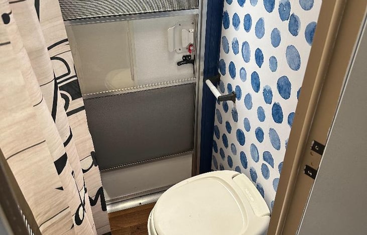 BATHROOM THAT HAS SECOND EXIT/ENTRY DOOR.