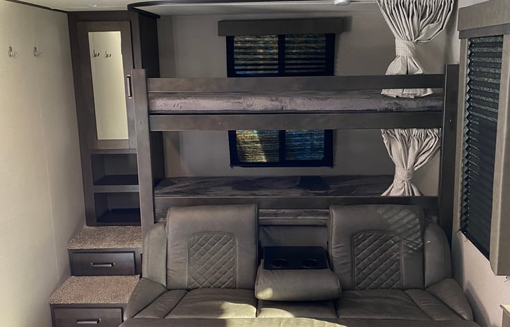 Jackknife sofa with pull down drink holder in middle for relaxing