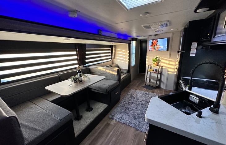 Spacious living area with a 32” wall mounted TV