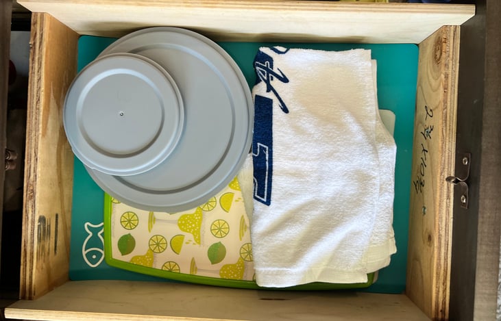 Cutting boards, hand towels, & some Tupperware included.