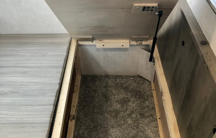 Storage under the dinette benches (both sides).