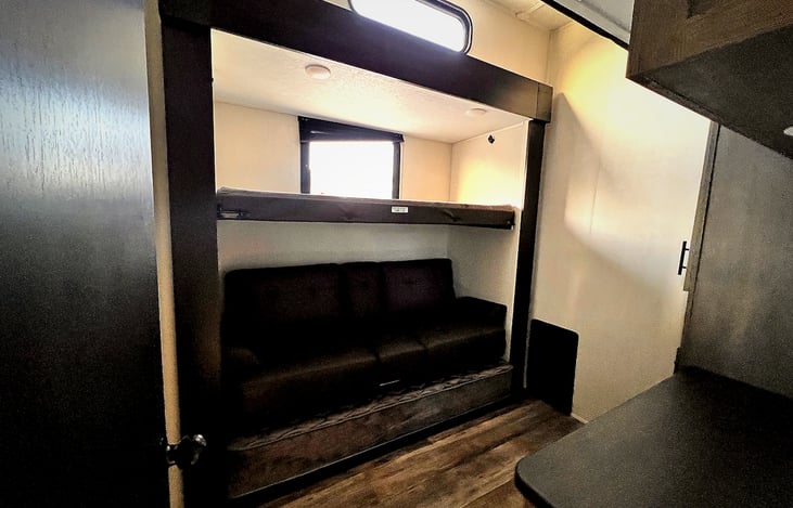 Top bed, couch folds out to bed, and trundle bed slides out under that!
