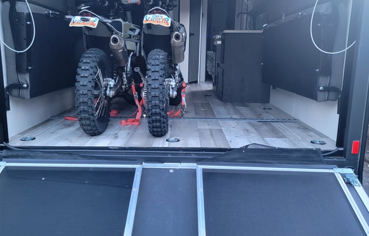 2 four-wheelers or 3 dirt bikes.