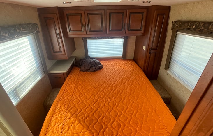 Queen "walk-around" bed. New mattress with 4" memory foam topper/linens included with rental.