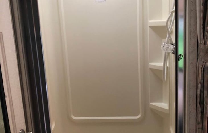 Shower, you can open the bathroom door to block the rest of the motorhome for privacy .