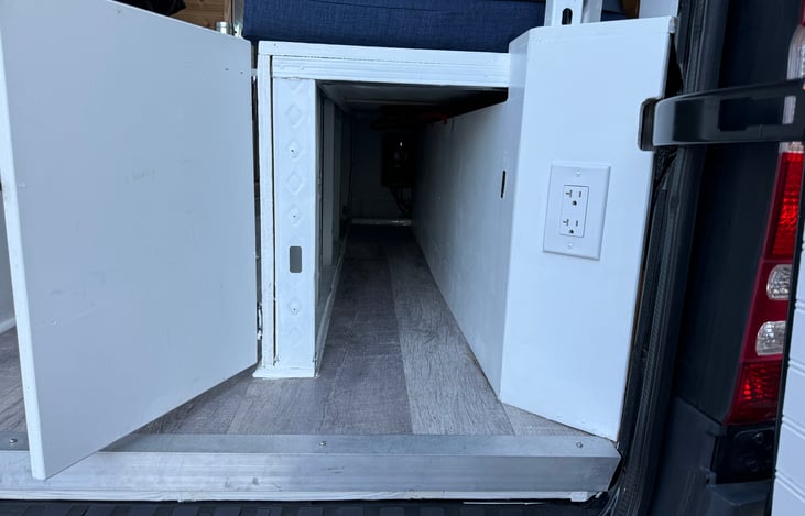 Under the right bench: Bulky item storage. Able to fit skis / snowboards / golf gear