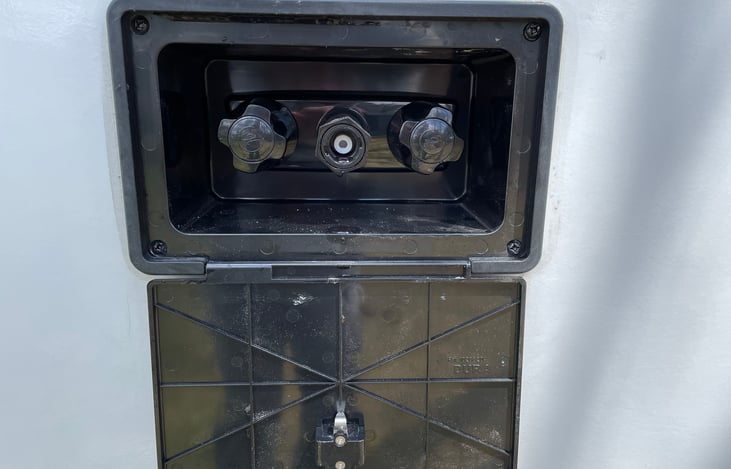 Outdoor shower with hose and sprayer