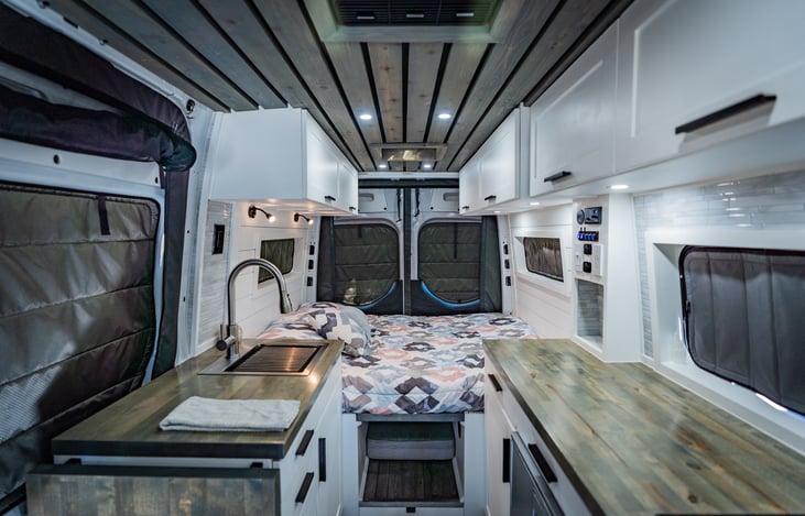 Spend your nights staring at the stars with the back doors open while lounging in this full size bed!