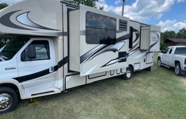 Driver Side with Dinette/Refrigerator and Closet Slide outs.