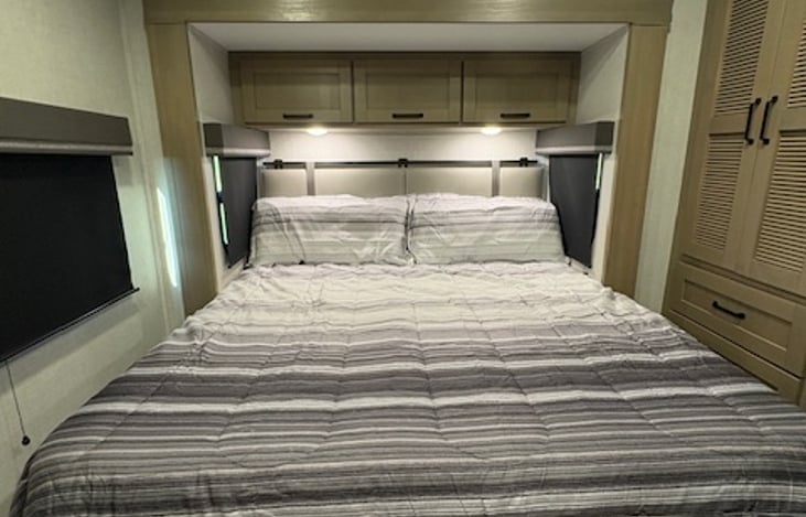 Private rear bedroom with upgraded king bed gives even more room to relax