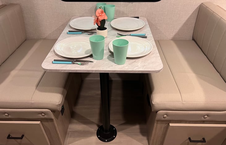 Dining setup. This also converts to a small bed for an extra guest if needed!  Under the seat is an outlet, and the DC to AC inverter.