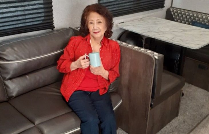 Mom having a nice cup of coffee on couch