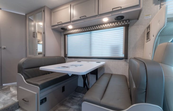 Dining  and storage area. Converts into full Size bed.