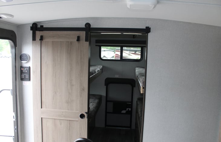 Bunkhouse room with privacy door