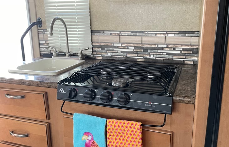 Stove and kitchen sink with cabinets