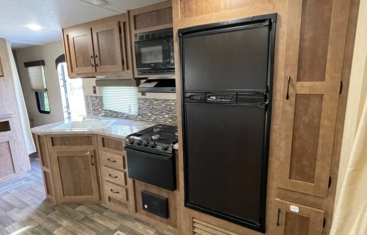 Ktichen complete with dinnerware, pots and pans, cups, utensils for up to 8 people 

Refrigerator and freezer