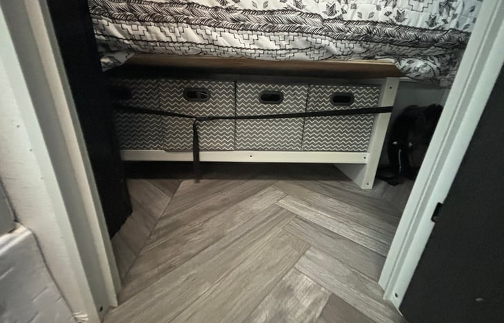 Storage under queen bed in private room