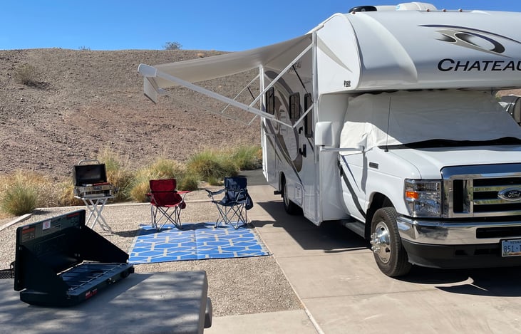 Electrical awning with LED lights. Outdoor rug and windshield privacy cover included. Grills and camping stoves are available as an add-on.