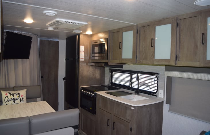 View facing kitchen and back of the camper/bunk area.