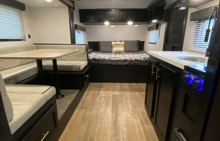Queen size bed and convertible dinette to an additional full bed.