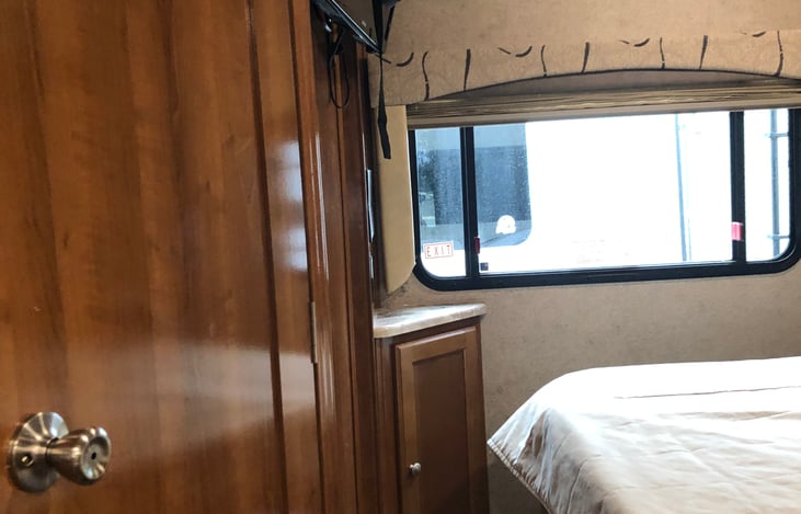 bedrrom with upgraded Queen bed and private bathroom