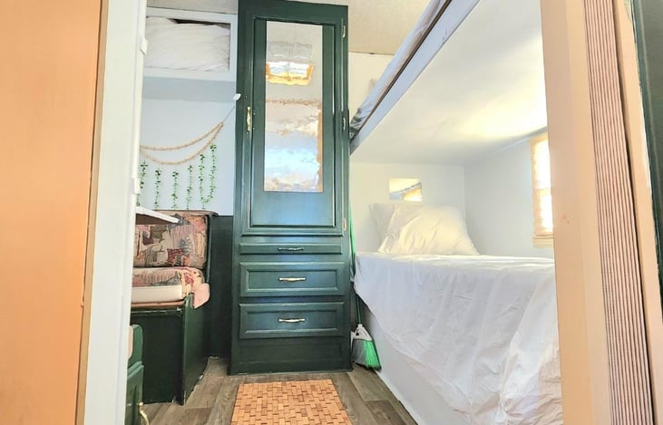 Plastic sheets cover the mattress and clean liens are provided along with blankets. 4 twin and 1 queen. 5 pillows. Broom/mop/trash bags/cleaning products