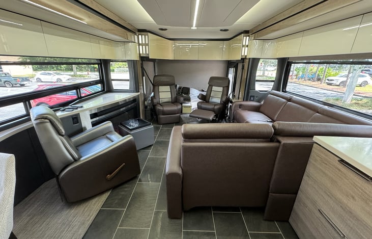 Two large, opposing slides extend to create a VERY spacious layout in the main living/eating area of this model.  There's a 3rd slideout for the main king sized bed.