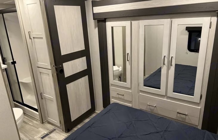 Primary bedroom with quick access to bathroom and shower