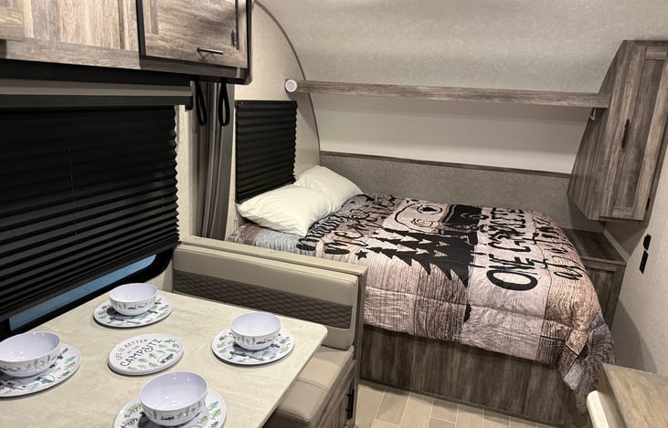 Kitchen/bedroom area. Cute camping dishes included for 4 people.