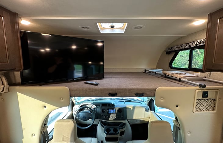 Over-the-Cab Double Bed has TV that Swivels so Everyone in the Living Area Can Watch