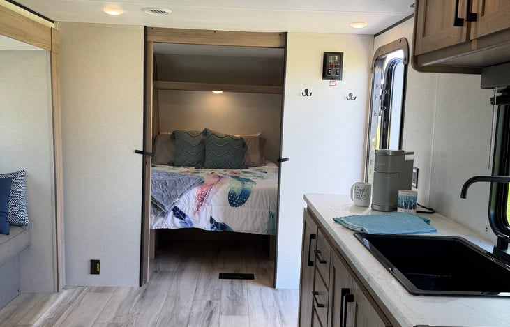 Your home kitchen on wheels, complete with a complimentary coffee maker, cookware, and utensils.