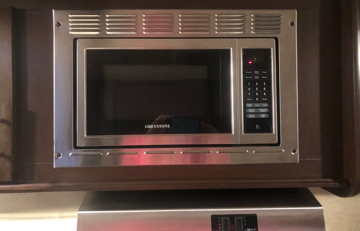 Microwave above cooktop and stove