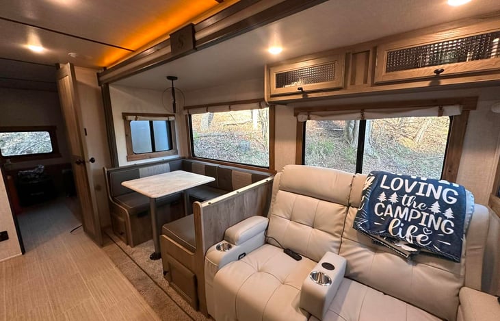Dining are and reclining sofa.