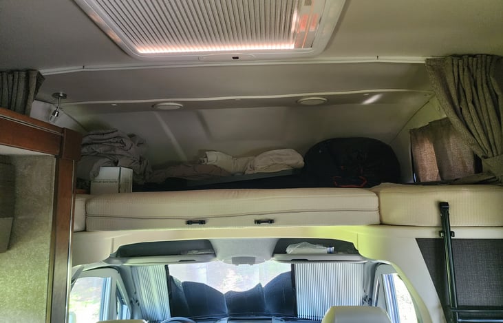 Additional bed above drivers cab, for kids or teens.