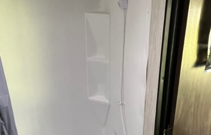 Plenty of room for a quick shower or great place to store your cooler full of your favorite beverages that allows you to drain it without moving it.