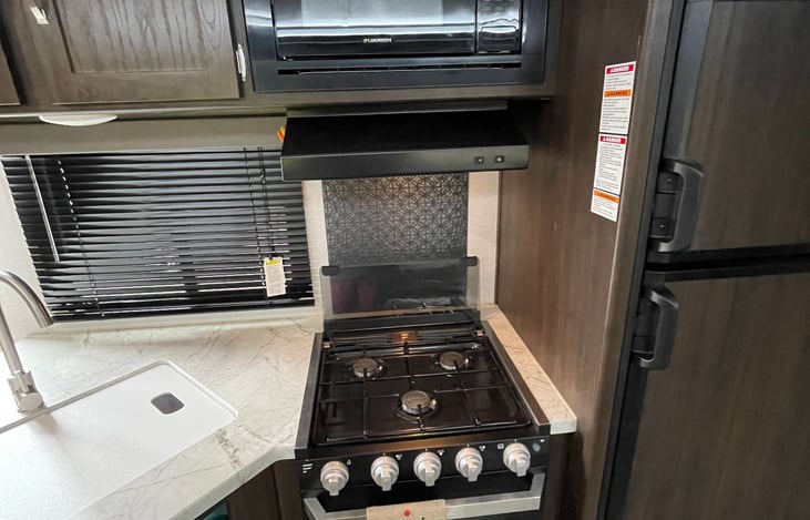 3 burner stove and large sink.
