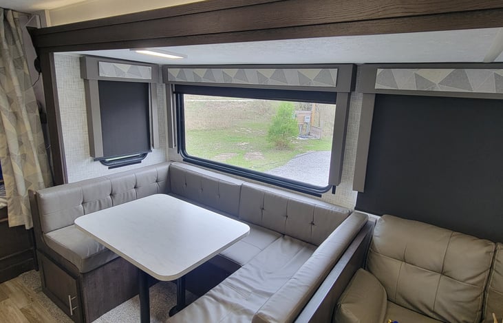 U-shaped dinette with plenty of seating. It also converts to double bed. (Foam topper available upon request)