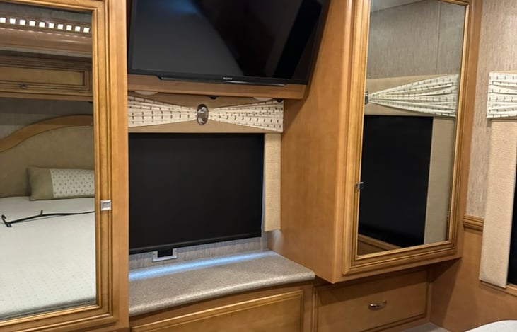 Master bedroom closets and 6 drawers on the bottom with TV and VCR