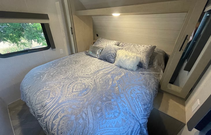 Main bedroom features lots of storage and a Custom King bed!!