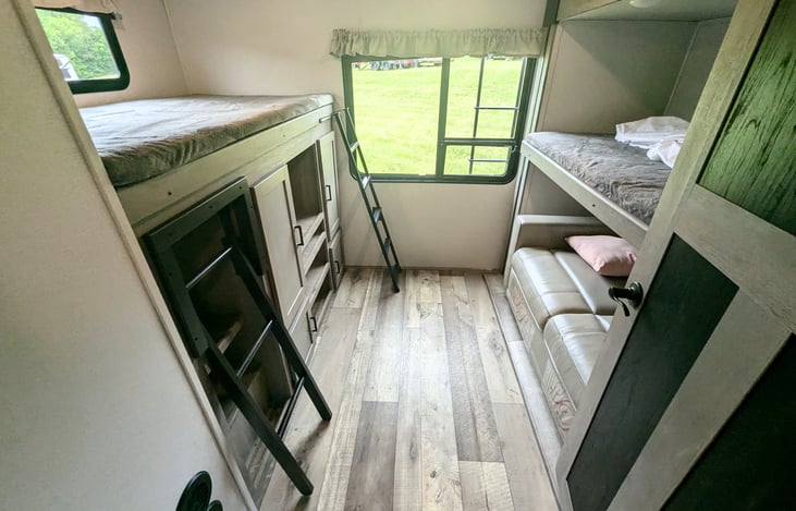 Spacious galley and fully-equipped kitchen. Plenty of room for everyone. Private bunkhouse and private bedroom on opposite ends. Pop-up TV to keep everyone entertained. Ample storage.