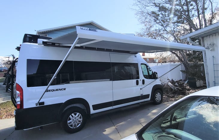 Awning - attaches to the van or the posts can rest on the ground