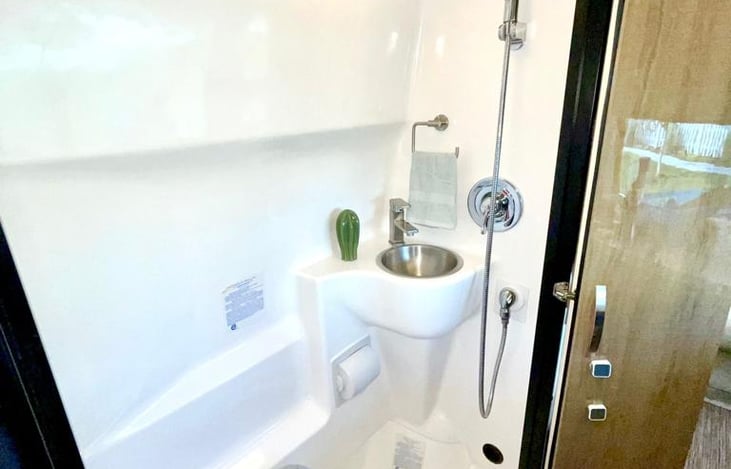 Full bath with Shower, Sink, and Toilet.  Hot and cold water for the shower and sink.