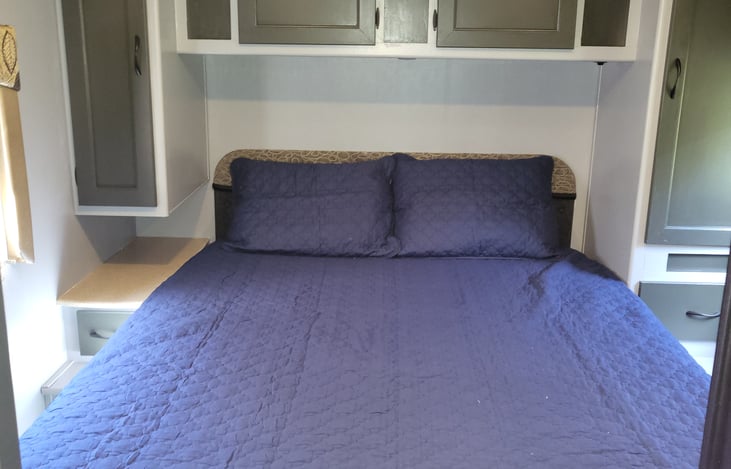 Queen bed with tons of storage in back room