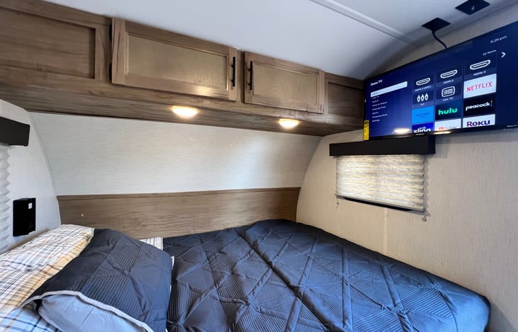 32-inch Smart Roku TV. You can take it to the TV mount outside as well.