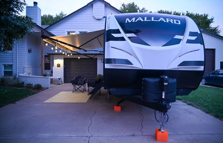 View from the front, showcasing the bumper pull hitch and the sleek design of our Heartland Mallard 26. Ready for your next adventure with ease and style!