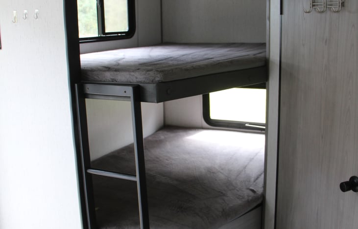 Full sized bunk beds that can sleep 1 or 2 each, storage available under lower bed. USB ports in both bunks.