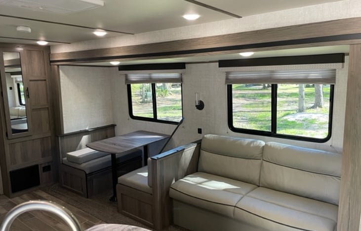 Dinette that can convert to sleeping area and a pull-out sofa for extra guests. And those big windows make for a nice view of the park.