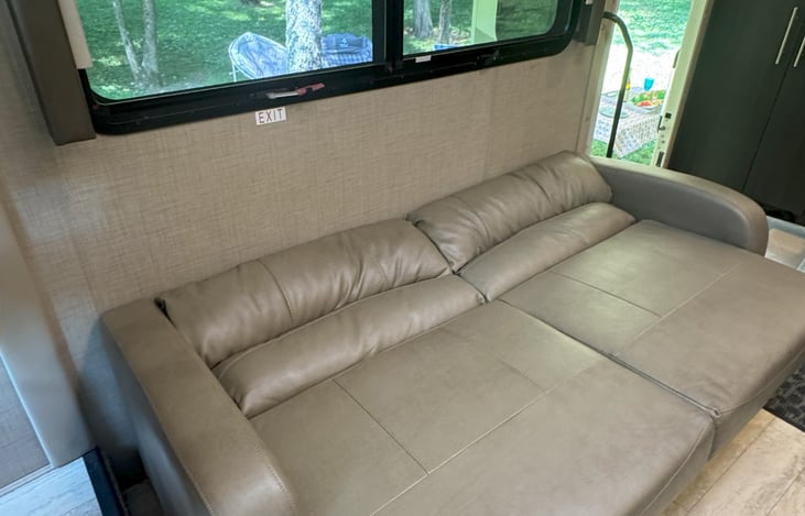 Brand new couch drops down to a comfy bed for two