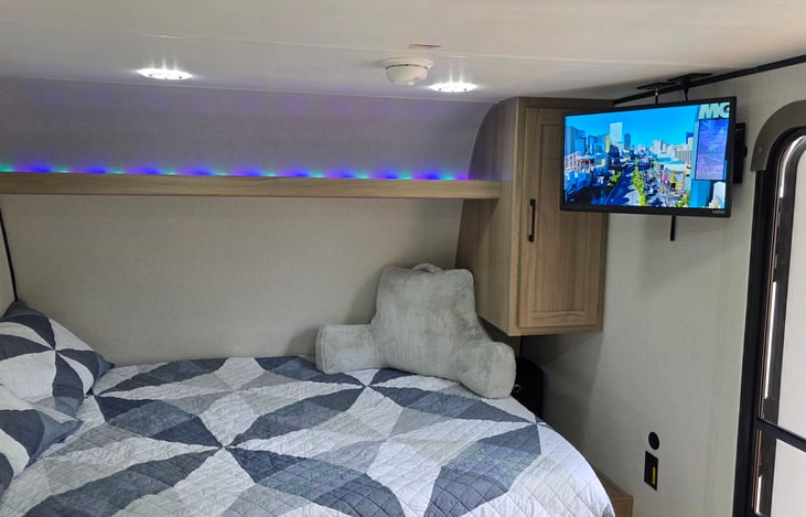 Queen Bed with TV on wall